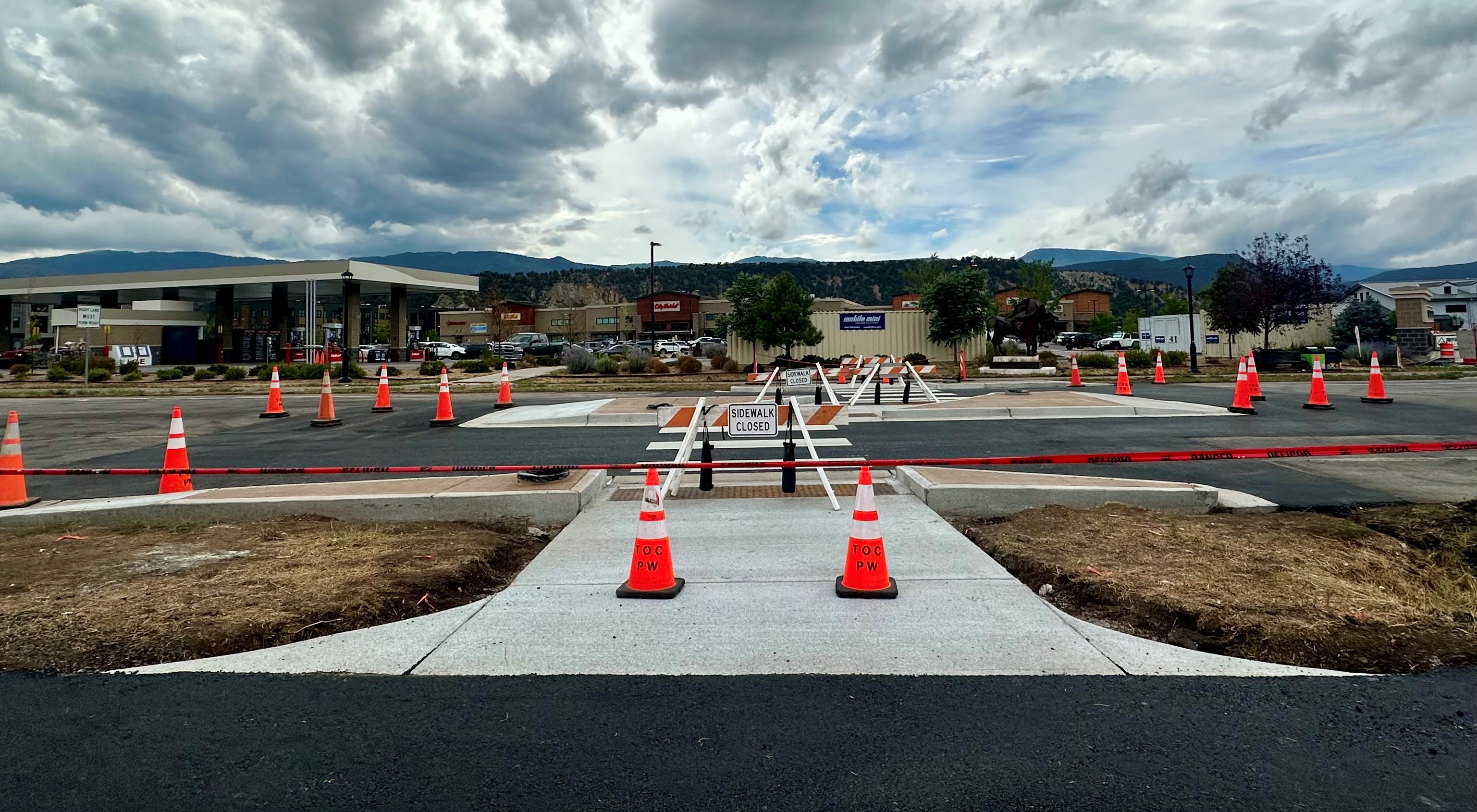 Closed pedestrian crosswalk with orange cones