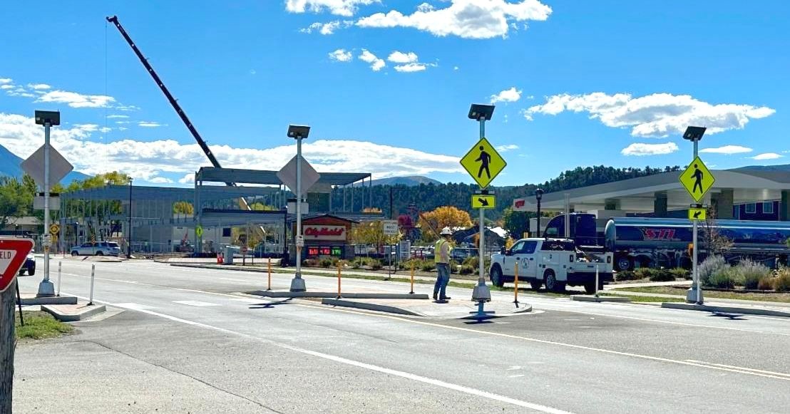 Man crossing the crosswalk on the highway