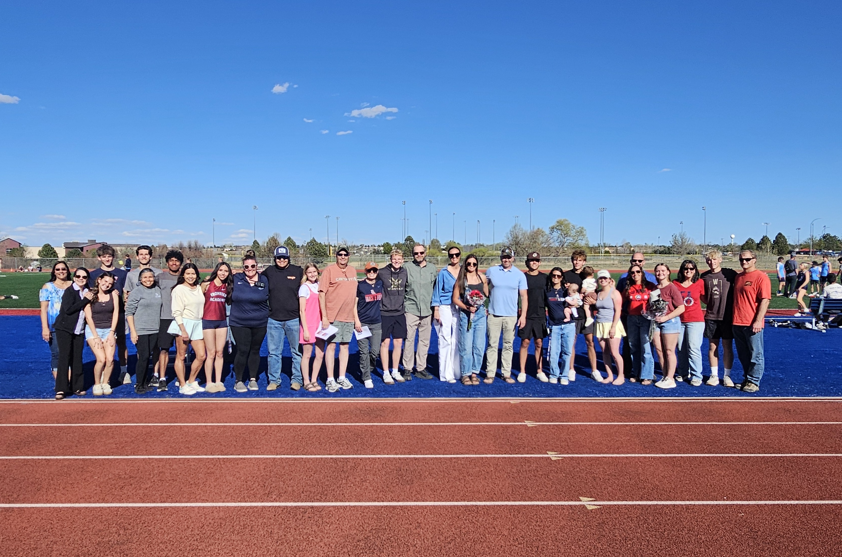 Senior track athletes and their families